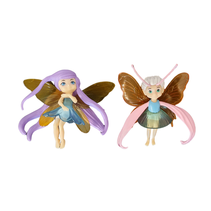 Zwei Fee-Figuren: lila Flügel-Fee im blauen Kleid und rosa Flügel-Fee im grünen Rock