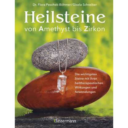 Buchcover mit großem Schriftzug „Heilsteine“ und Anhänger an zwei Steinen
