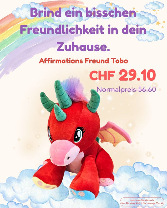 Rote Plüschfigur mit türkisfarbenen Hörnern, Einhorn-ähnlich, freundliche Ausstrahlung